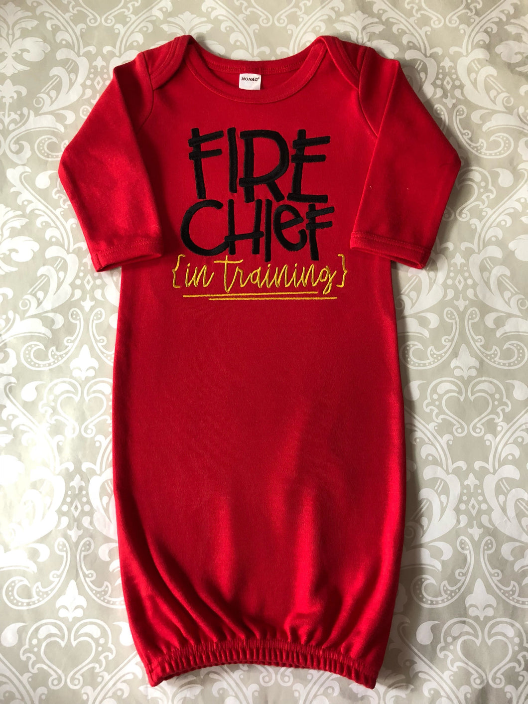 Fire chief in training red baby gown
