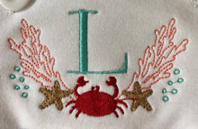 Crab monogram ruffle sun suit