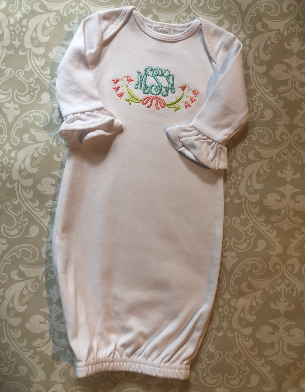 Monogram ruffle baby girl gown