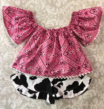 Off the shoulder pink bandanna top with cow print ruffle shorts