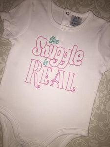 The Snuggle is real embroidered baby bodysuit